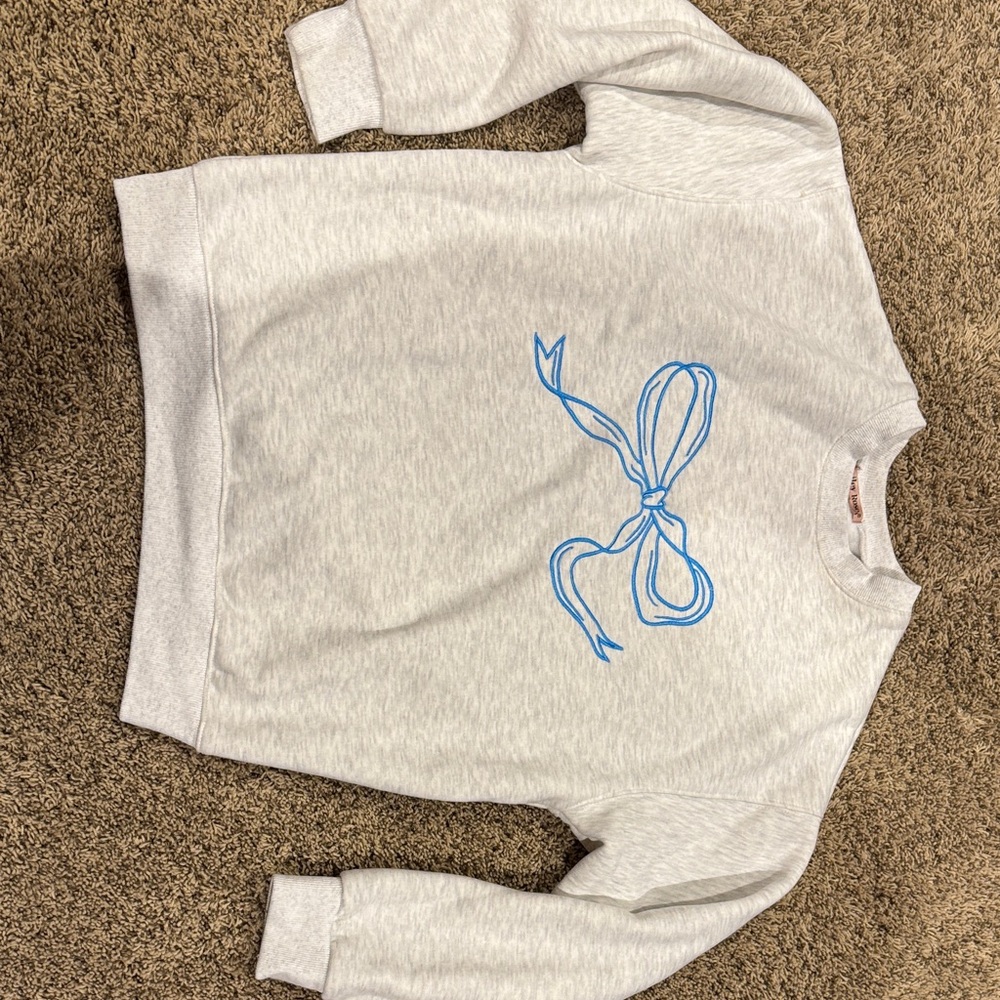 Gray Sweatshirt with Blue Bow Design